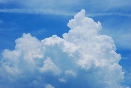 Blue sky with clouds and sunの写真素材