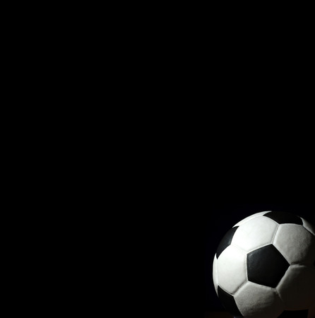 Soccer football background texture light shadow on the black background for designの写真素材