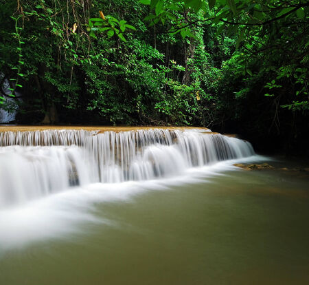 Waterfall with blue stream in the nature Thailand forestの写真素材
