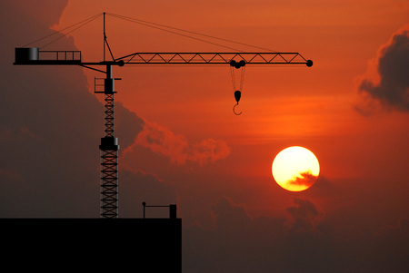 Crane working construction for business industrial and sunset background for designの写真素材