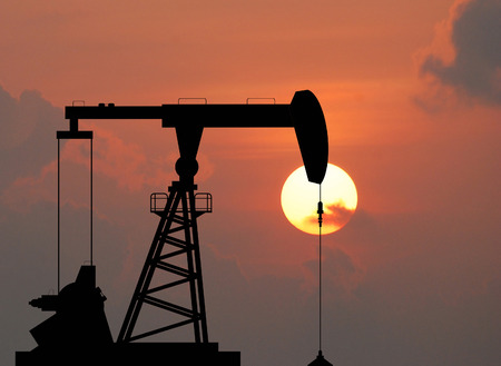 Oil pump oil rig energy industrial machine for petroleum in the sunset background for design