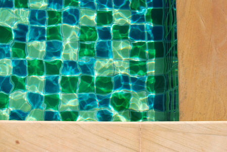 Swimming pool water background texture with space for text designの写真素材