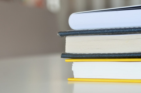Books on the white table for background and text designの写真素材