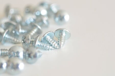 Screw and nuts on white backgroundの写真素材