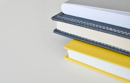 Books on the white table for background and text designの写真素材