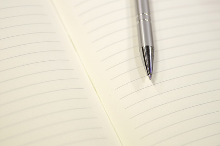 Pen and note book for background artwork designの写真素材
