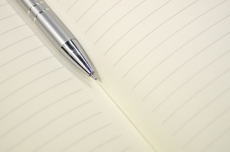 Pen and note book for background artwork designの写真素材