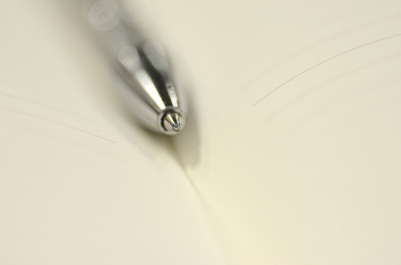 Pen and note book for background artwork designの写真素材