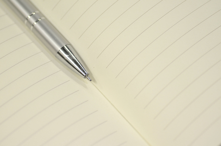 Pen and note book for background artwork designの写真素材