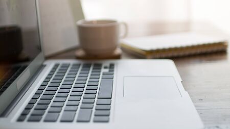 Home office desk with laptop computerの写真素材