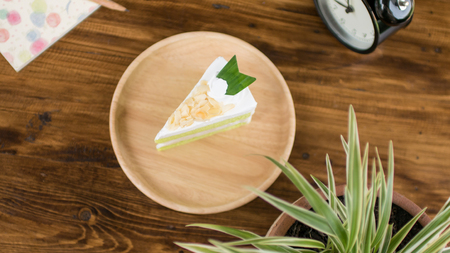 green tea green cake on wooden table for relaxation timeの写真素材