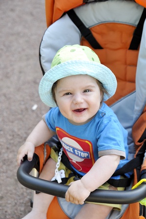 Happy baby in buggyの写真素材