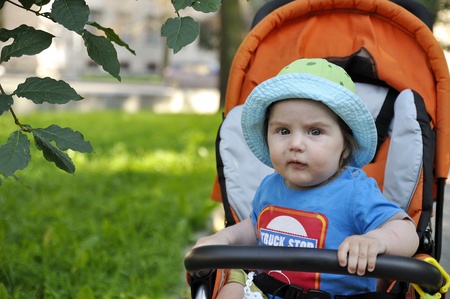 serious baby in buggyの写真素材