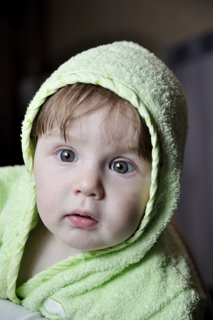 Portrait baby in green gownの写真素材