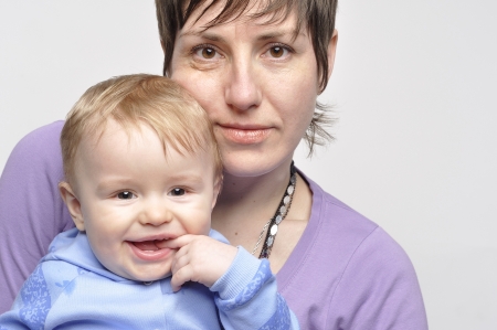Mother holds the smiling childの写真素材