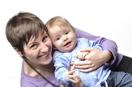 Mother holds the smiling childの写真素材