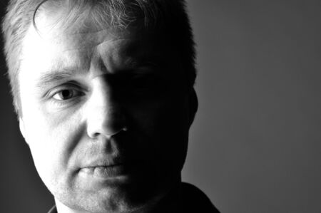 Portrait of the mature man in a profile black and whiteの写真素材