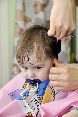 Hairstyle of the one-year-old child first timeの写真素材