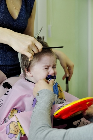 Hairstyle of the one-year-old child first timeの写真素材
