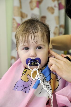 Hairstyle of the one-year-old child first timeの写真素材