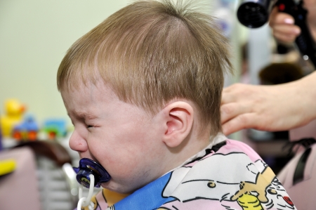 Hairstyle of the one-year-old child first timeの写真素材