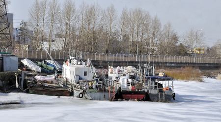 Old ships moored to port in the winter timeの写真素材