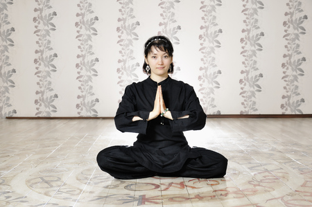 Young woman in the prayer lotus position.の写真素材