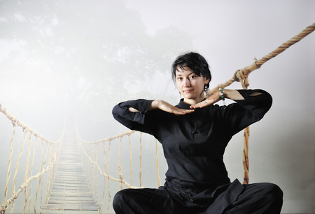 Young woman relaxing in lotus pose