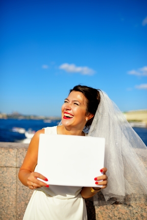 Portrait of a bride with plate on quay Neva river, Saint-Petersburgの写真素材