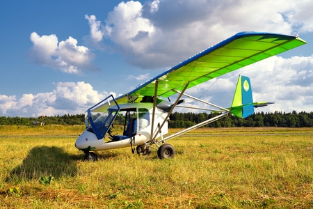 Ultralight weight plane on a grass fieldの写真素材