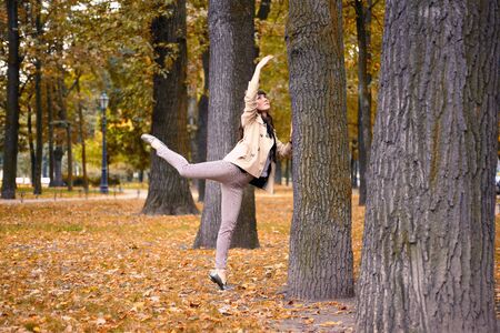 Ballet dancer posing in a garden the city of St. Petersburgの写真素材