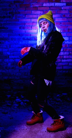 Portrait of funny zombie girl in halloween timeの写真素材