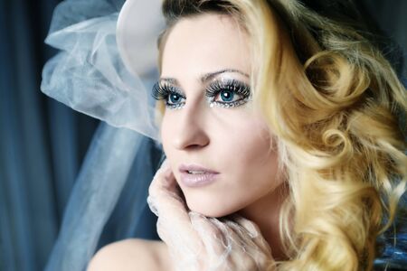 Fashion stylish beauty bride portrait with white long curly hairの写真素材