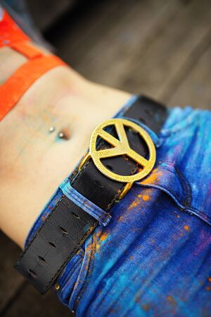 Belt buckle with symbolics of hippie - peaceの写真素材