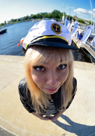 Fun fisheye view on girl looking as seamenの写真素材