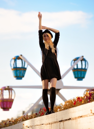 Young pretty hipster girl outdoor in sunny day, wearing casual clothiers hatの写真素材