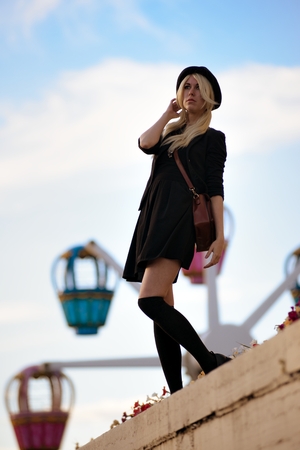 Young pretty hipster girl outdoor in sunny day, wearing casual clothiers hatの写真素材