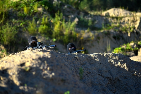 Two soldiers in action