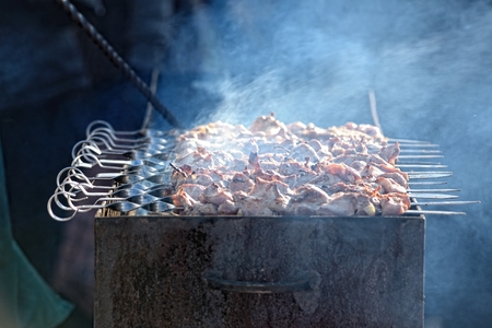 Preparation of kebab (shashlik) on brazier on streetの写真素材
