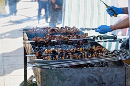 Preparation of kebab (shashlik) on brazier on streetの写真素材