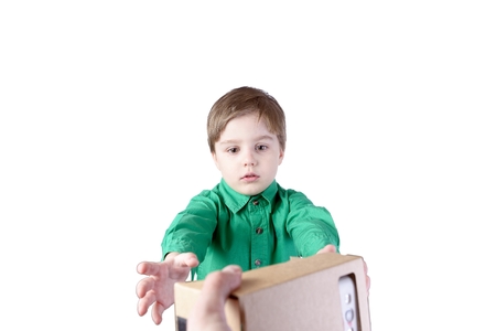 Little child takes virtual reality (VR cardboard) isolated on white background