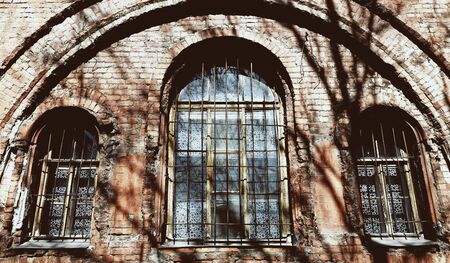Old window with rusty barsの写真素材
