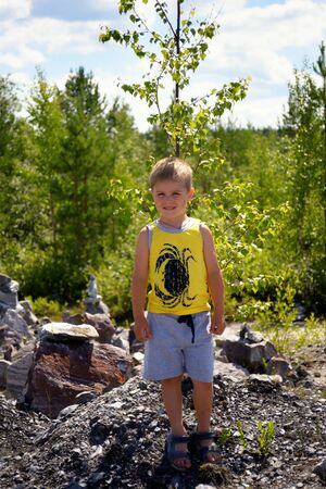 Portrait of a cute boy posing in parkの写真素材