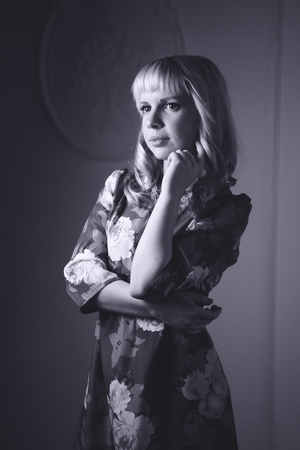 Black and white portrait of lovely woman in dressの写真素材