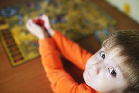 Little child plays board gameの写真素材