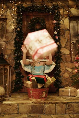 Snow Maiden throw present. Doorstep of house decorated in Christmas styleの写真素材