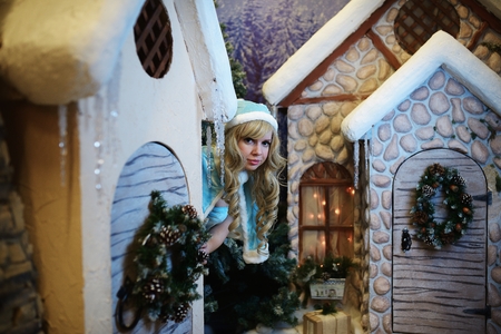 Beautiful Snow Maiden in studio Christmas interiorの写真素材