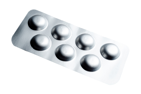 Aluminum blister pack of tablet isolated on white backgroundの写真素材