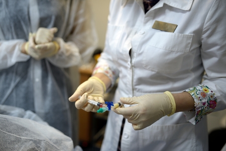 Collection plasma from the tube with a syringeの写真素材