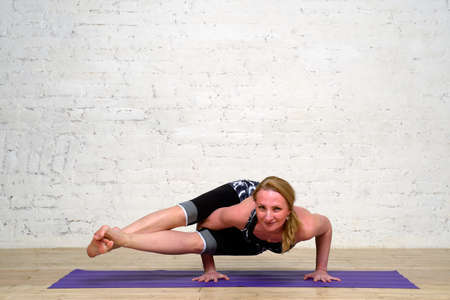 Adult woman practicing yogaの写真素材